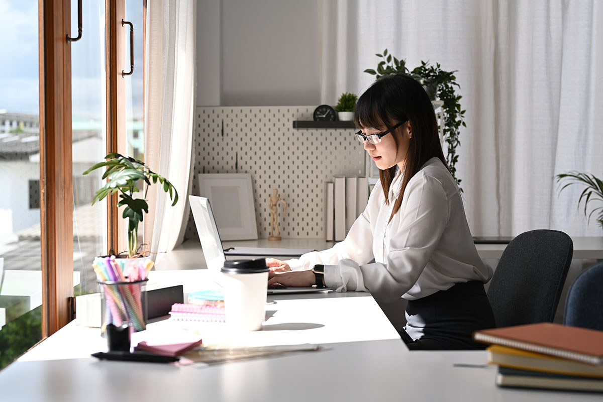 woman in office on computer