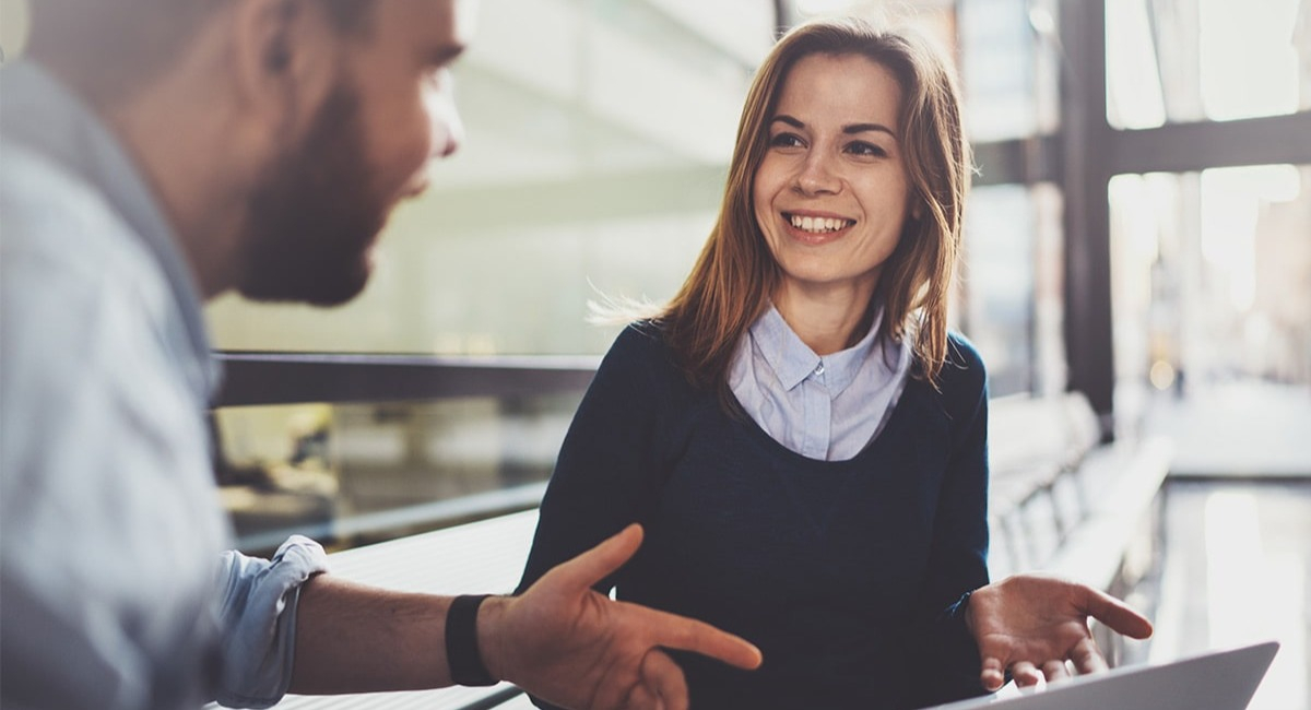 woman collaborating ideas with her co-worker